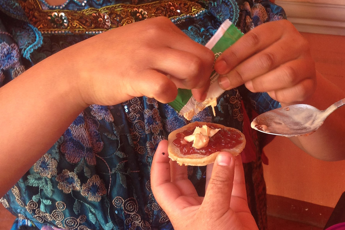 Women preparing a peanut butter-like snack