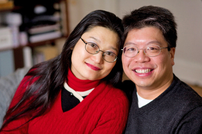 Close-up of a couple smiling at the camera.