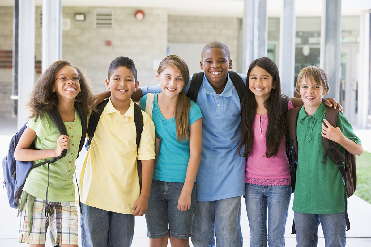 A group of elementary school children smiling.