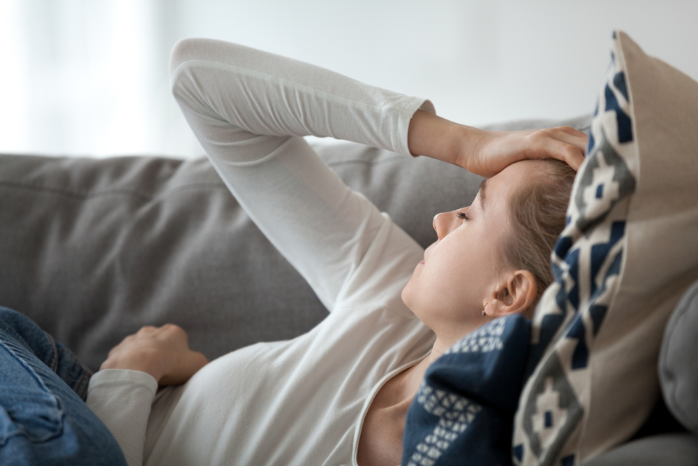 A woman lying on the couch