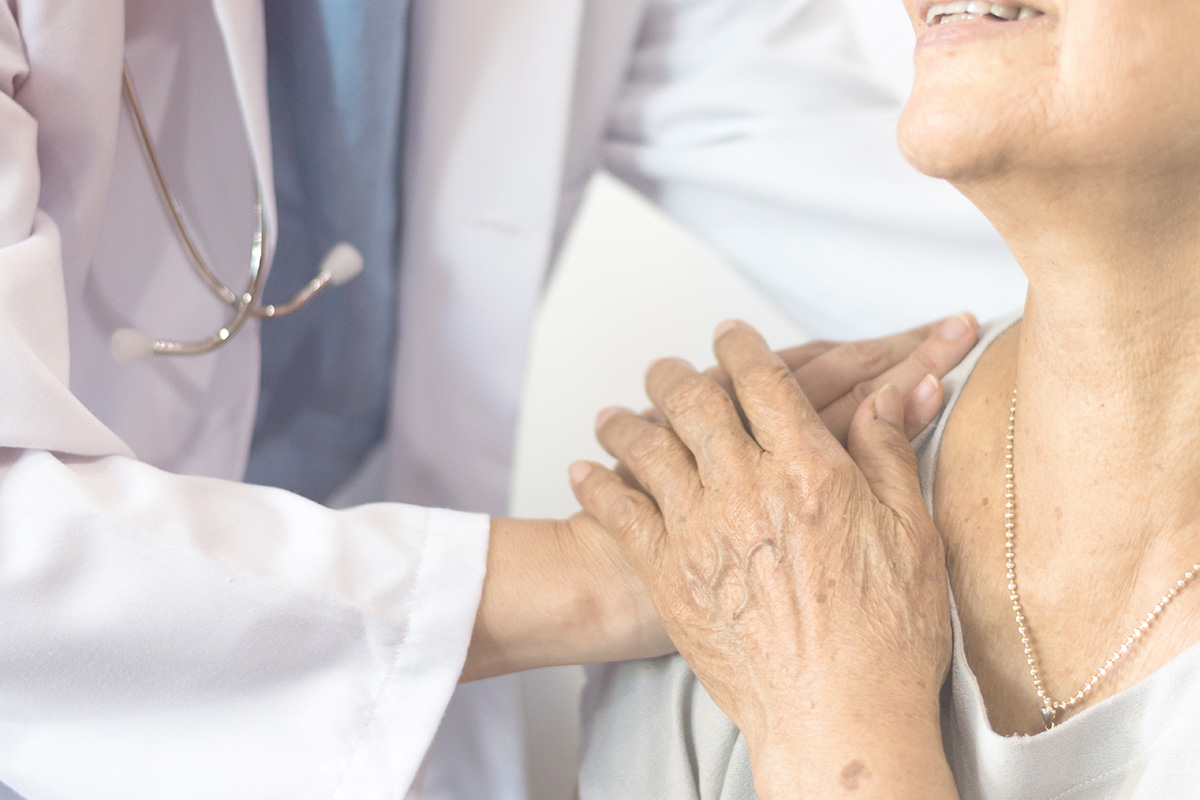 Image of a doctor consoling a patient