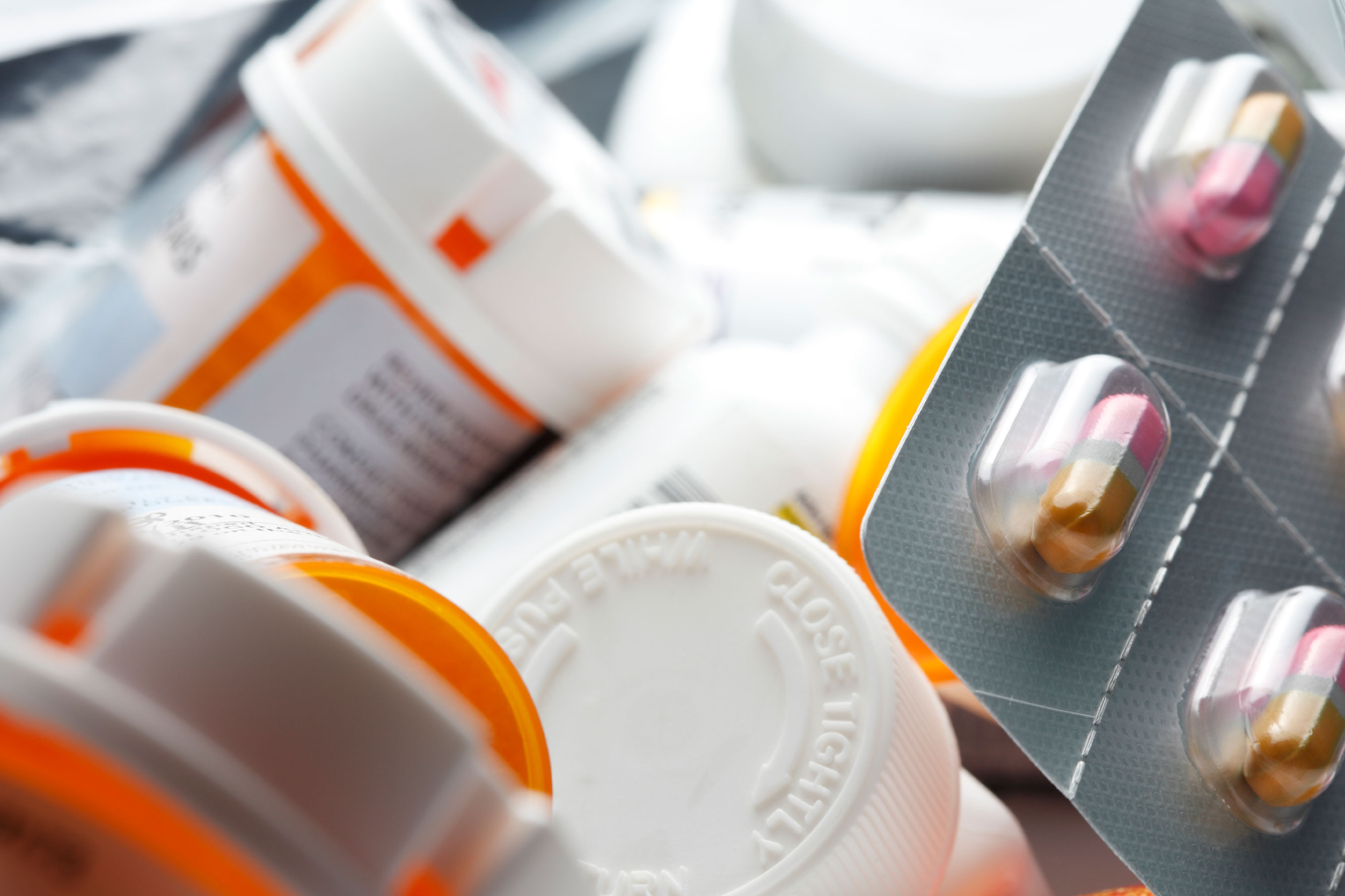 Photo of medicine bottles and capsules