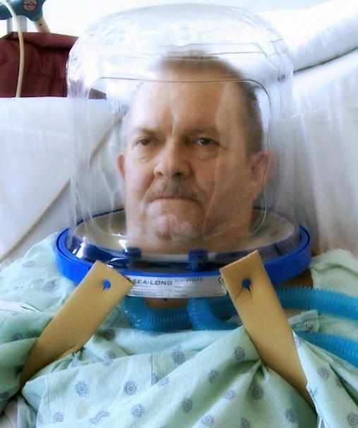 Man in ventilation helmet