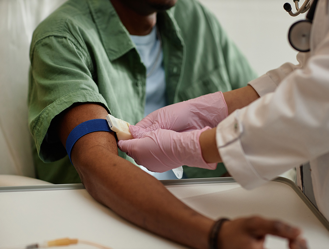 Nurse preparing a patient's arm for a blood test