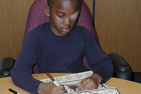 Child with a patch for treating amblyopia (lazy eye).