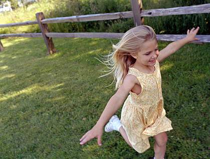 A young girl running in the park