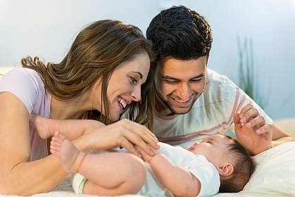 Photo of a woman, a man, and a baby