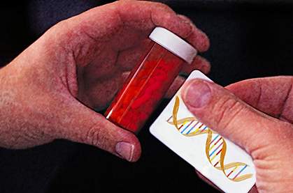 Photo of hands holding a medicine vial and a DNA label Photo of hands holding a medicine vial and a DNA label