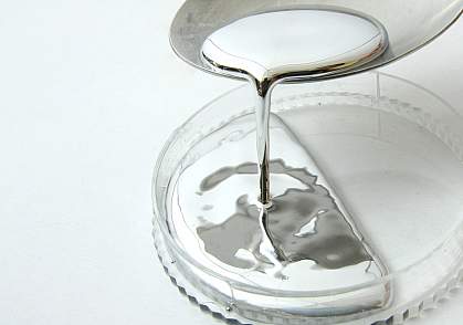 Image of mercury dripping from a spoon Image of mercury dripping from a spoon