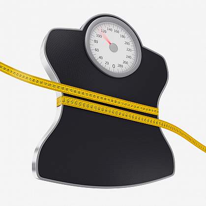 Photo of a yellow tape measure wrapped around a scale