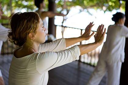 People in a tai chi class. People in a tai chi class.