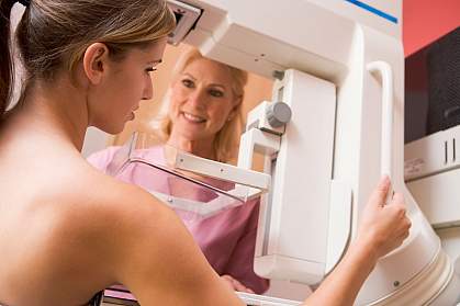 Woman getting a breast exam.