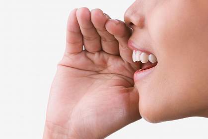 Close-up photo of a woman speaking.