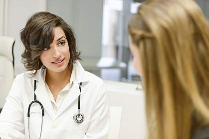 A doctor speaking with a patient