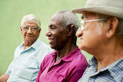 Senior men sitting in the park.