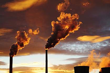 Smoke from coal power plant at sunset