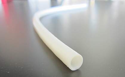 Close-up of narrow white tube. 