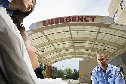 Paramedics wheeling patient into hospital Paramedics wheeling patient into hospital