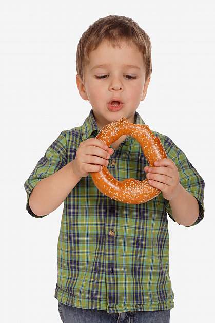 Boy with large sesame seed bagel