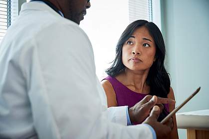 Doctor speaking with a female patient.