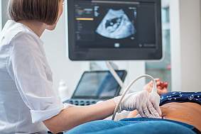 Pregnant woman on utltrasonographic examination at hospital 