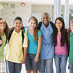 A group of elementary school children smiling.