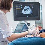 Pregnant woman on utltrasonographic examination at hospital 