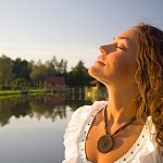 Photo of woman taking a deep breath