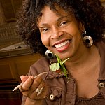 photo of a happy woman eating salad - cropped