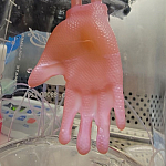 Glove made of bioengineered skin connected to ports for culture infusion in the laboratory