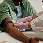 Nurse preparing a patient's arm for a blood test