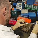 A scientist preparing DNA for analysis.